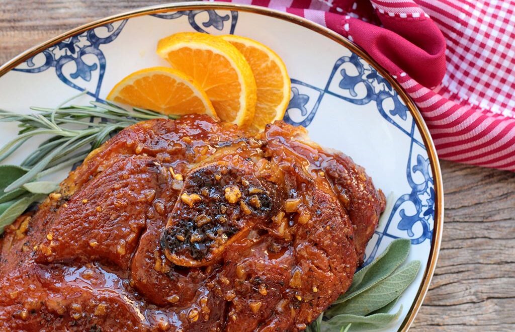 Pernil assado ao molho de laranja e alho